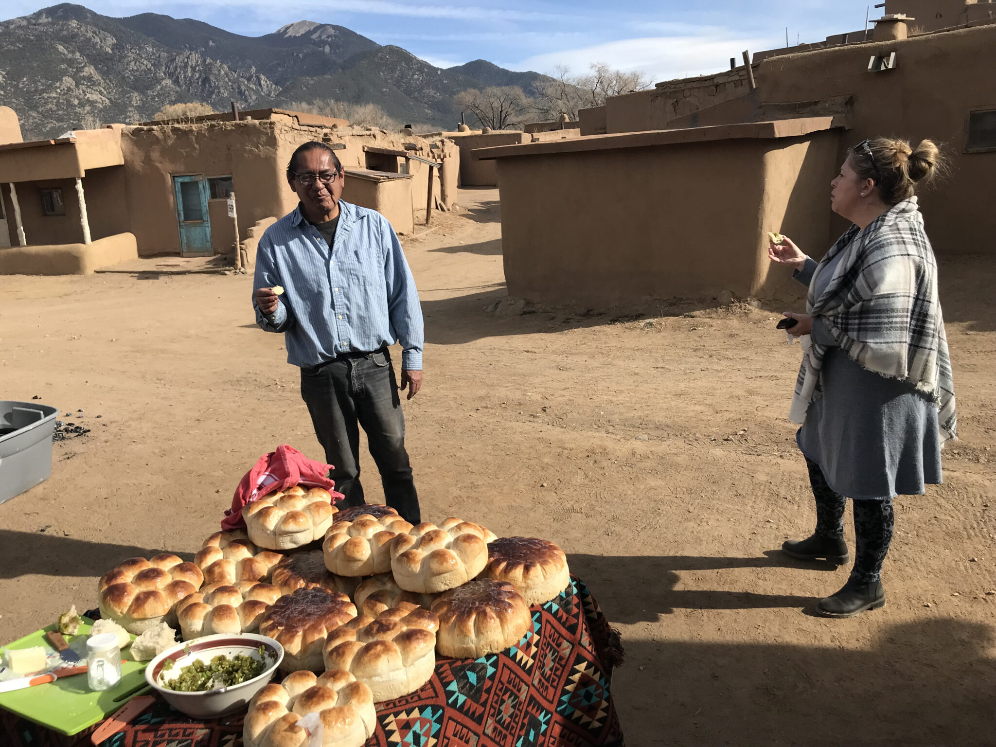 Explore the Rich Culture of Taos Pueblo, New Mexico Toasting Food