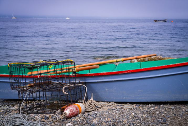 Crab Rings and Boat on Shore - Photo by Vision Photography