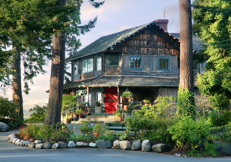 Captain Whidbey Inn in Forested Area by Sherrye Wyatt