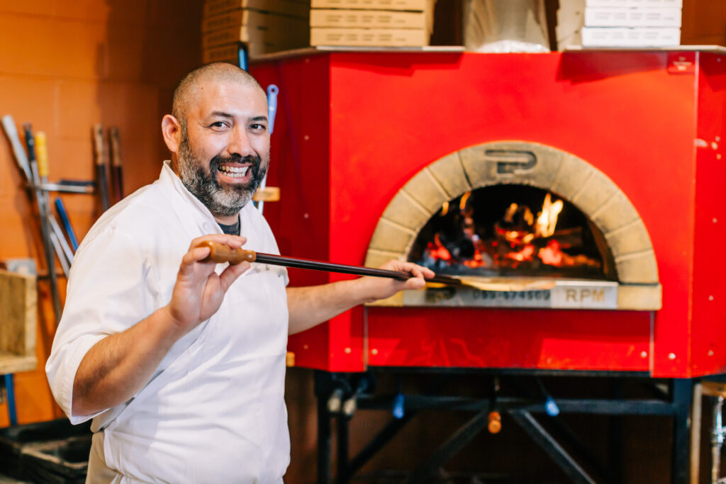 Chef with Wooden Pizza Oven at Ciao Restaurant