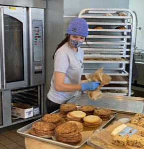 Baker with Cookies at Black Market Bakery