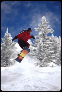 Snowboarder Midair by Jay Blackwood