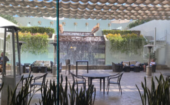 View of patio area with Neptune waterfall spouts inside the Westin South Coast Plaza