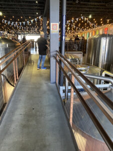 Bridge Into Mike Hess Brewing Co. Above Brewing Area