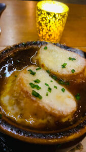 French Onion Soup Topped with Swiss Cheese Topped Crostini