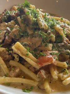 Penne Fennel Sausage with Peas, Mushrooms, and Roasted Tomato in a Cream Sauce