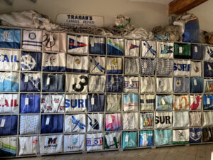 Rows and rows of Sea Bags made from old sails