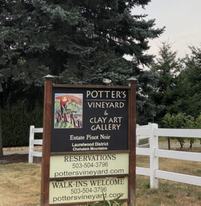 Potters Vineyard sign showing its also a clay art gallery