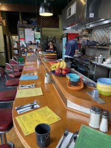 Streamliner Diner with its primary colored plates and bowls on a long countertop