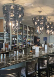 Farlows Bar with Black Granite Counter and Large Elaborate Hanging Lights