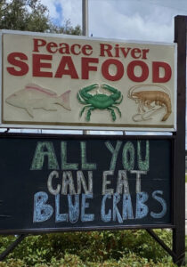 Peace River Seafood sign advertising "All You Can Eat Blue Crabs"