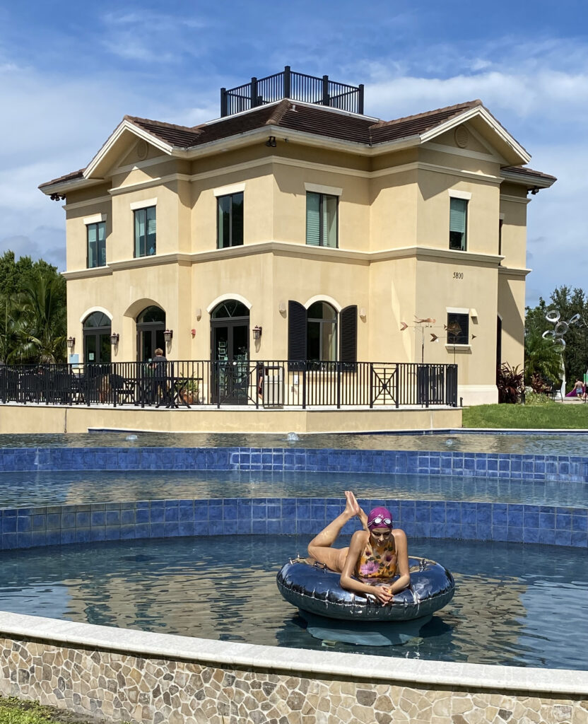 Sculpture of Woman on Float by Carole Feuerman in Pool in front of the home at Peace River Gardens
