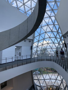 Dali Museum interior displaying its mosaic triangular glass pieces framing the fluid metal lines of the interior walkways