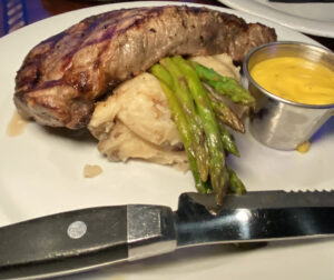 Rumfish Grill Steak with asparagus and potatoes with hollandaise sauce