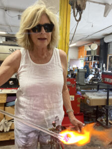 Me firing glass to make a wine glass at Zen Glass Studio