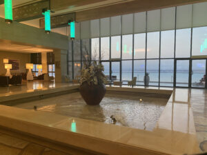 Hilton Dead Sea Resort lobby with fountain and view of Dead Sea out the window