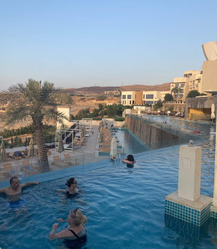 Hilton infinity pool with city and hills in the background