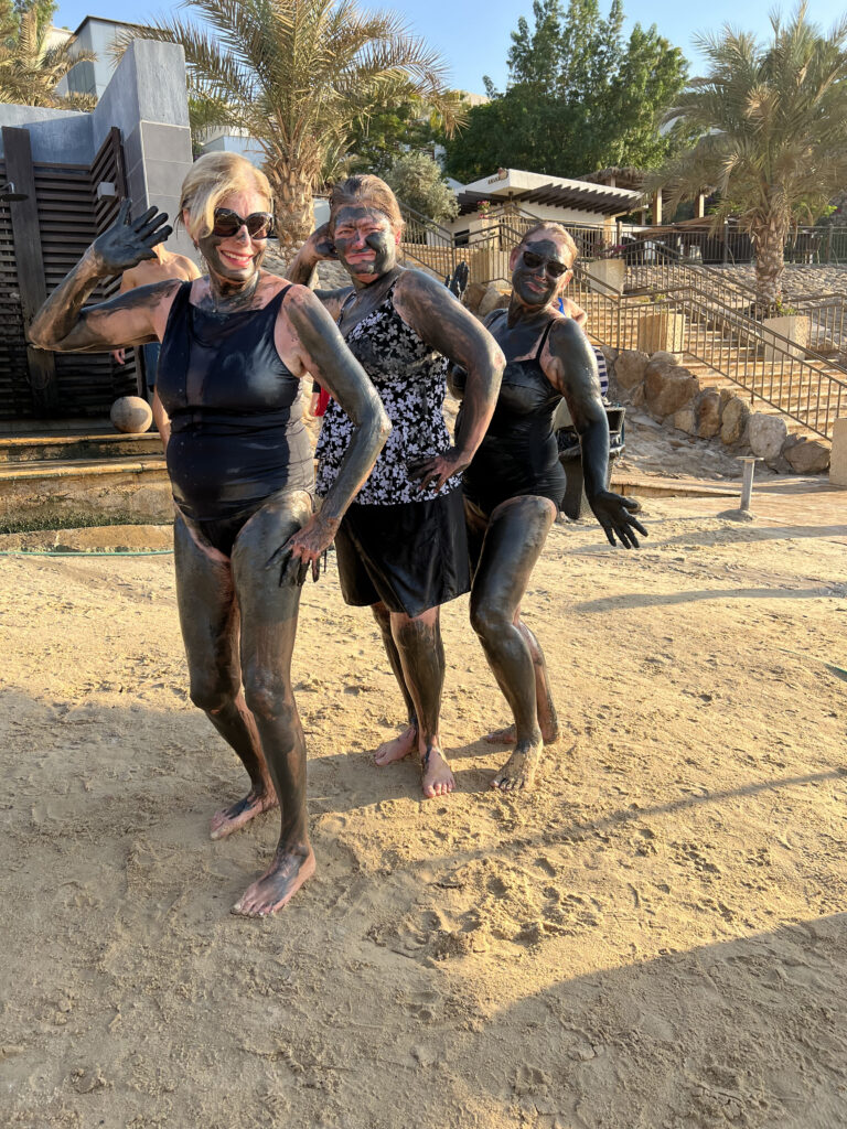 Three of our group covered with the healing Dead Sea mud