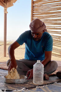 Hussein, the bread maker, kneading the bread