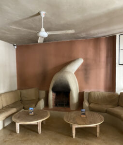 Feynan Ecolodge lobby with dome shaped fireplace and comfortable seating 