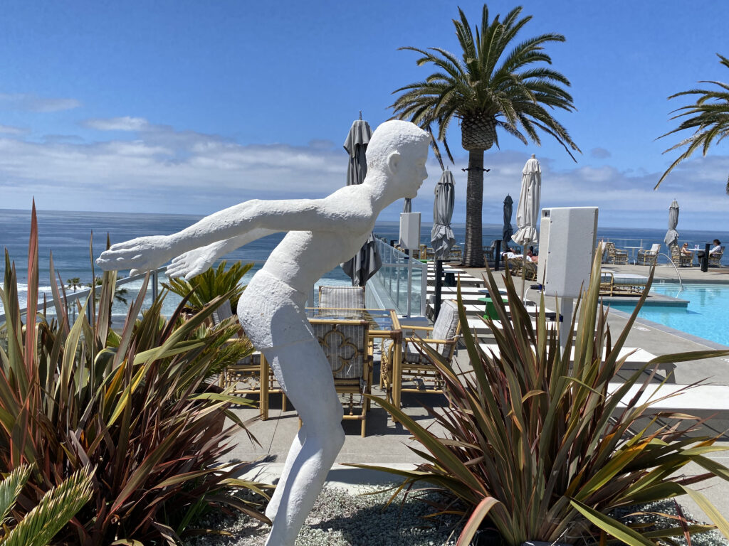 sculpture of a swimmer diving into the pool at Mission Pacific