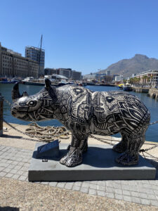 Large rhino sculpture along the V & A Waterfront painted in black and white swirls