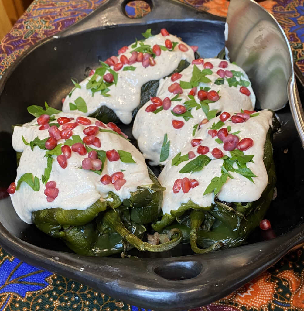 Chiles en Nogado, chiles stuffed with spices and meat with a creamy walnut and cheese sauce