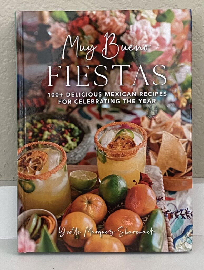 Muy Bueno Fiestas Cookbook cover with photos of chili-lined margaritas, chips, and guacamole