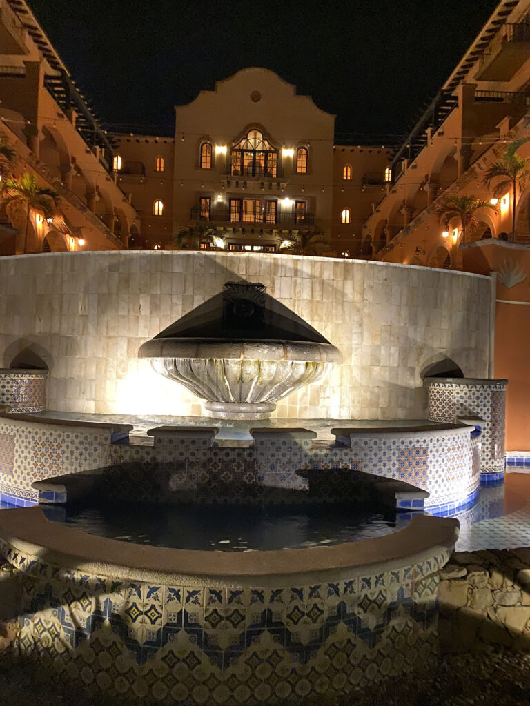 Mexican tiled fountain with the resort lobby in the background