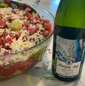 Messina Hof torquoise bottle lable of Riesling paired with a Watermelon, Cucumber, and Feta Salad